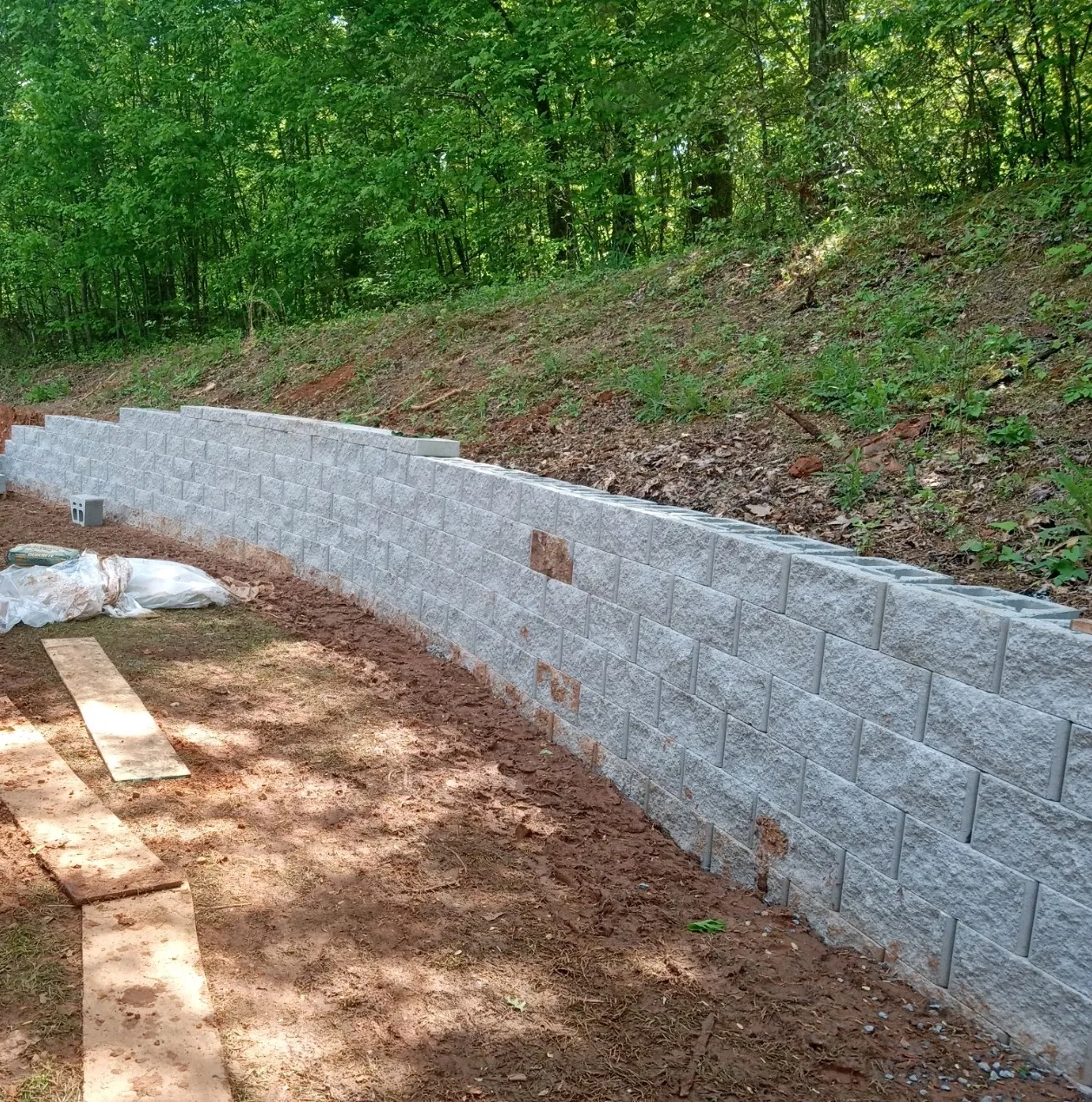 A concrete block wall is being built.